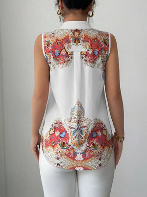 White sleeveless collared shirt with vibrant paisley print on back and hem