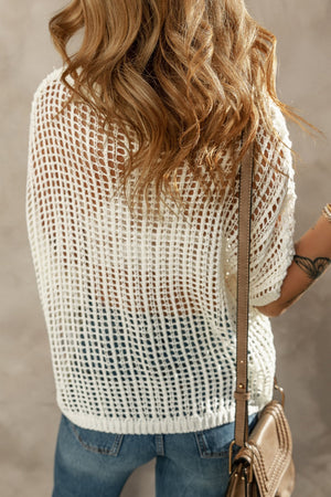 White open-knit slouchy shoulder cover-up with a relaxed fit and short sleeves.