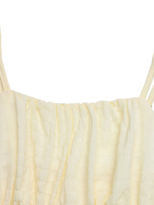 Gathered bodice mini dress in apricot with smocked detail and thin straps.