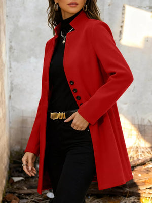 Chic scarlet longline trench coat with button-down detail and collarless neckline.