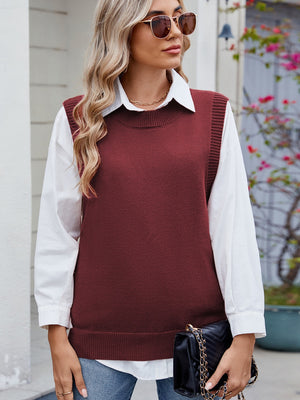 Burgundy ribbed knit vest with crew neck and side buttons, styled over a white shirt.