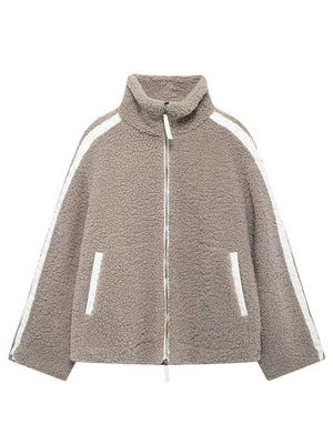 Dust Storm teddy fleece zip-up jacket with white contrast piping and zip pockets.