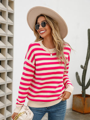 Pastel stripe crewneck knit sweater in cream and bright pink acrylic, with a casual fit.