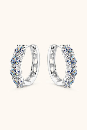 Silver pavé crystal huggie earrings with five round-cut stones each.
