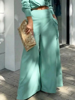 Teal two-piece set with pocketed wide-leg pants and long-sleeve top.