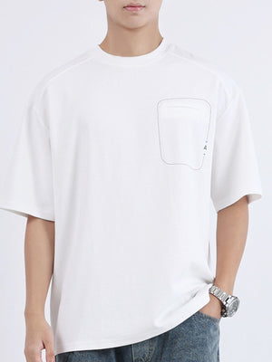 White cotton crew neck t-shirt with decorative pocket detail and half sleeves.