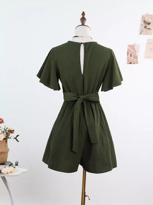 Olive green romper with flutter sleeves, tie waist, and keyhole back detail.