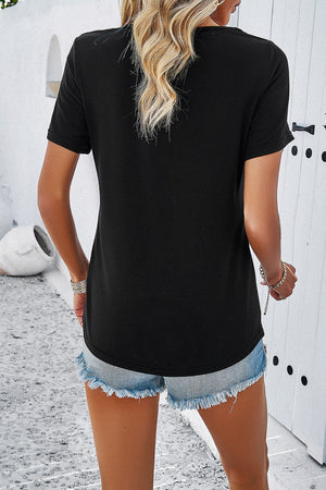Black V-neck t-shirt with short sleeves and a relaxed fit, styled with denim shorts.