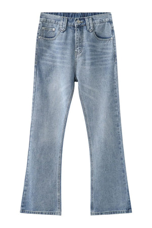 Wide-leg denim jeans in medium wash with carpenter pockets and a slight flare.