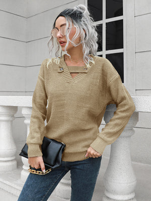 Khaki knit sweater with V-neck, keyhole detail, and button accents.