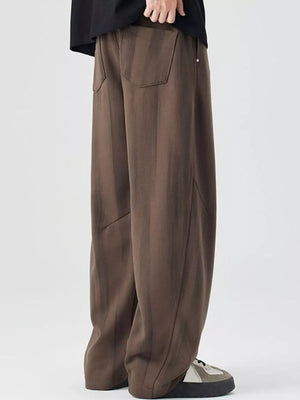 Brown striped jogger pants with back pockets and drawstring detail.