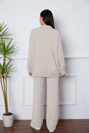 Relaxed knit polo co-ord set in ivory with wide leg pants and a collared long sleeve top.