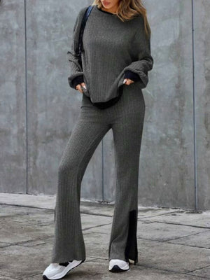 Gray ribbed knit lounge set with slit hem pants and crewneck sweater.