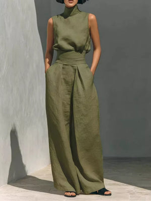Army green sleeveless turtleneck and wide-leg pants set with belted waist.