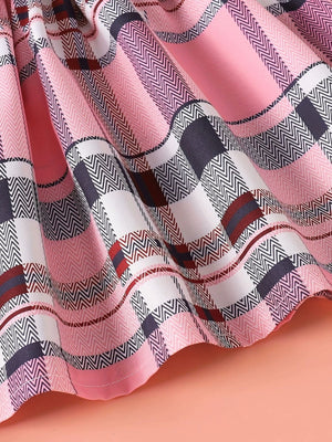 Children's pink plaid dress with ruffled hem detail