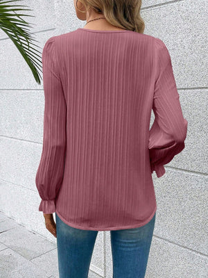 Light Mauve textured pleat blouse with ruffled cuffs and long sleeves.