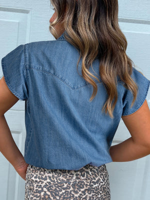 Denim button-up shirt with short sleeves and western yoke detail.