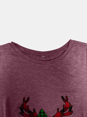 Maroon tee with asymmetrical button detail and plaid reindeer graphic.