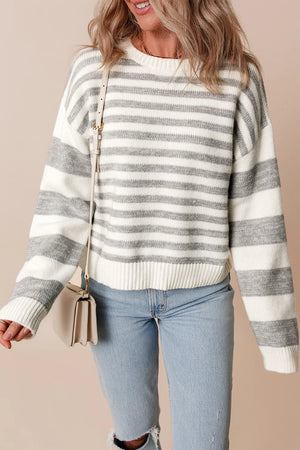 Relaxed fit striped knit sweater with crewneck and ribbed trim, in white and grey acrylic blend.
