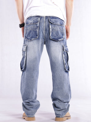 Relaxed fit light wash denim cargo jeans with flap pockets and contrast stitching.