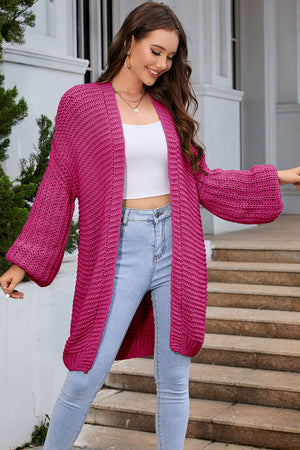 Hot Pink textured knit cocoon cardigan with balloon sleeves and open front.