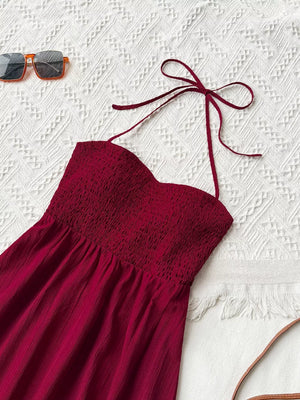 Burgundy halter neck maxi dress with smocked bodice and tie straps.