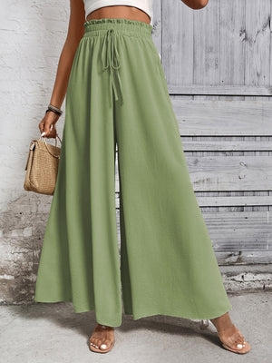 Light green ruffled waistline palazzo trousers with drawstring and wide leg