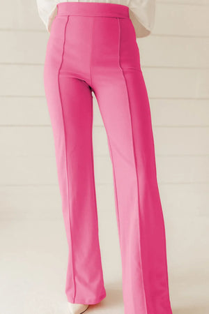 Pink seamed flare leg trousers with a high waist and visible stitching detail.