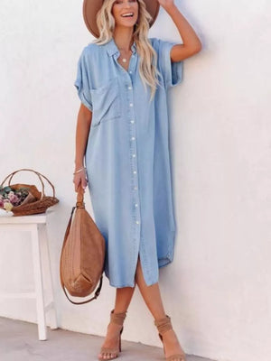 Light blue denim midi shirt dress with short sleeves, button front, and side slits.