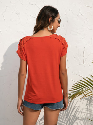 Red Orange lace shoulder detail tee with short sleeves and a scoop neckline.
