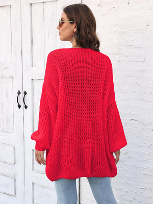 Red open knit cardigan with balloon sleeves and a relaxed fit.