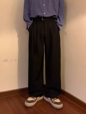 Black wide-leg sweatpants with a belted waist and D-ring detail.