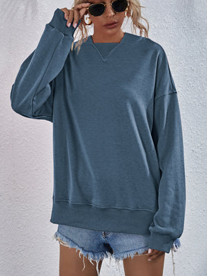Dusty Blue sweatshirt with V-neck detail and ribbed cuffs and hem.