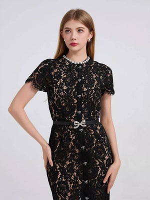 Black lace mermaid dress with pearl collar and jeweled bow belt