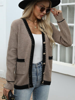 Taupe knit cardigan with black contrast trim and gold buttons, V-neck, long sleeves, pockets.