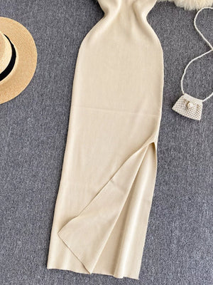 Ribbed knit midi dress with high slit and cutout back detail.