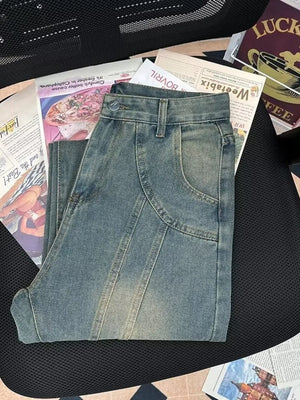 Men's light wash denim flare jeans with seam details and a vintage look.