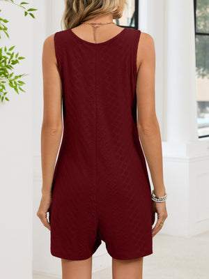 Burgundy sleeveless romper with subtle embossed pattern and scoop neck.