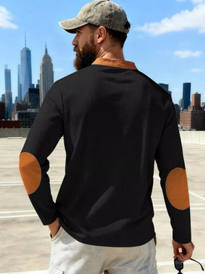 Black long-sleeve men's t-shirt with apricot elbow patches and collar.