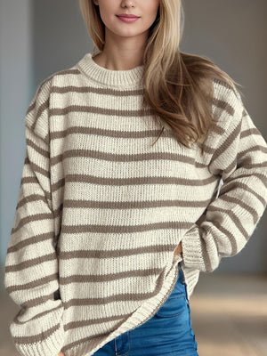 Breton stripe relaxed knit sweater in tan and white with crewneck and long sleeves.