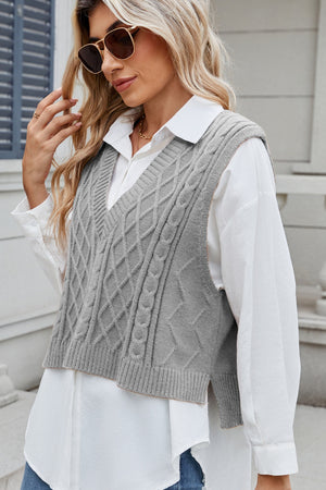 Gray cable knit diamond pattern sweater vest with V-neck.