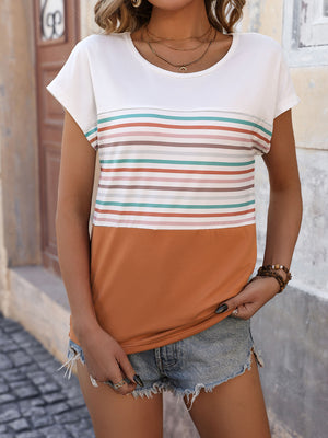 Colorblock stripe t-shirt in white with colorful horizontal stripes and a burnt orange bottom.