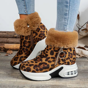 Leopard print plush ankle boots with side zipper and chunky sole.