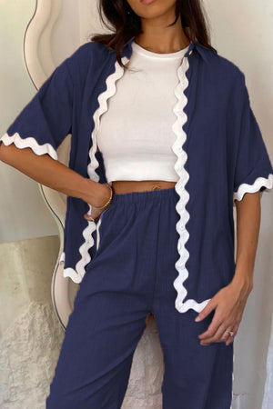 Dark blue scalloped edge co-ord set with white trim, featuring a cropped top and wide-leg pants.