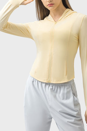 Light yellow active hoodie with zipper and thumbholes, fitted cut