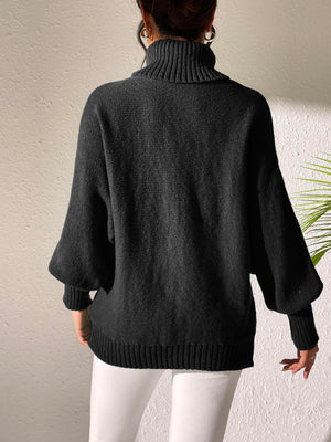 Black balloon sleeve turtleneck sweater with relaxed knit and ribbed cuffs.