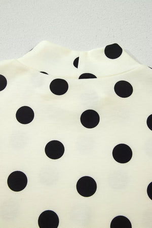 Cream polyester t-shirt with black polka dots and high neckline
