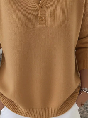 Buttoned long-sleeve knit top in brown with a Henley neckline and ribbed hem.