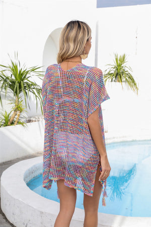 Open-knit pastel beach cover-up with colorful stripes and tassel details.