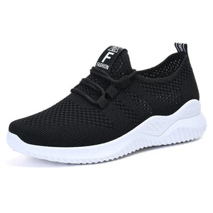 Black breathable knit runner sneaker with white sole and logo detail on tongue.